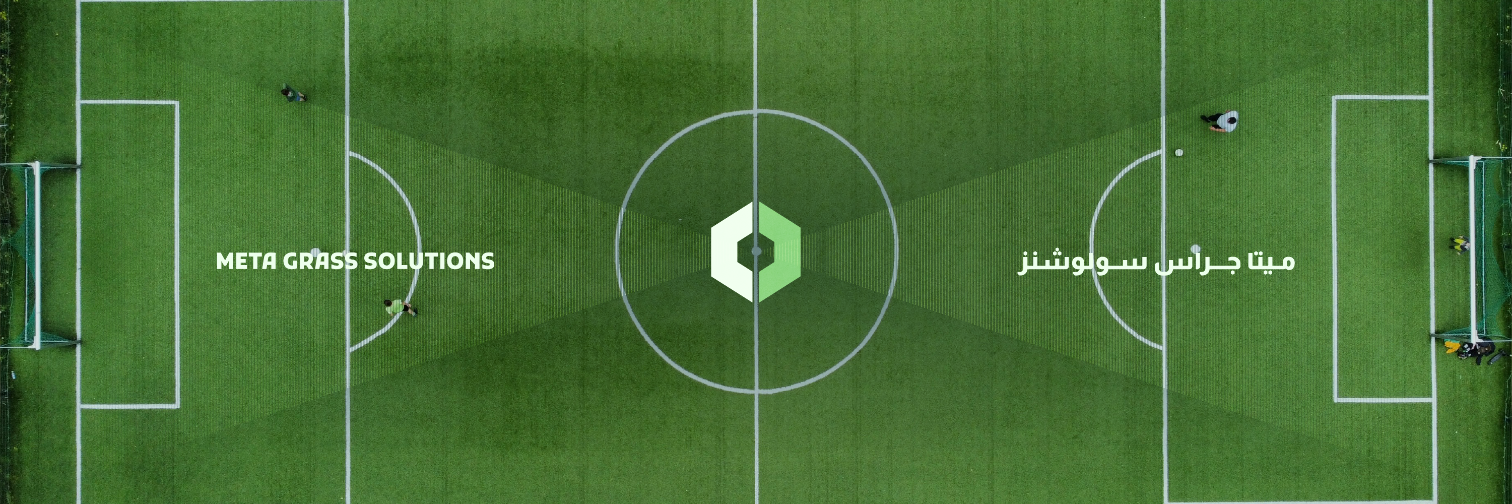 Meta Grass Solutions branding across a professional football pitch